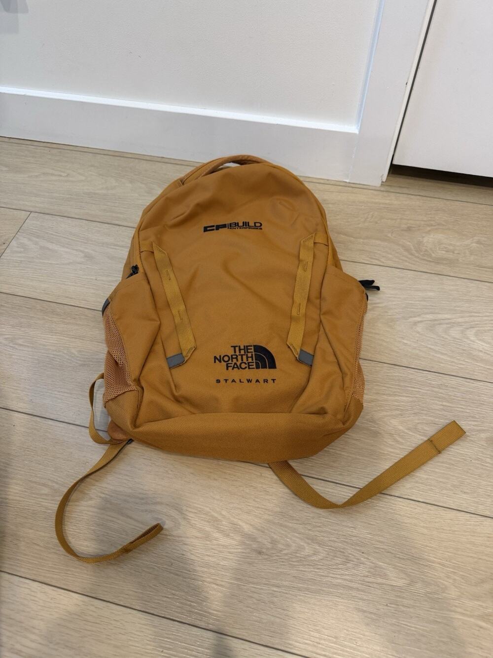 The North Face Stalwart Backpack in timber tan, customized w/a Logo.